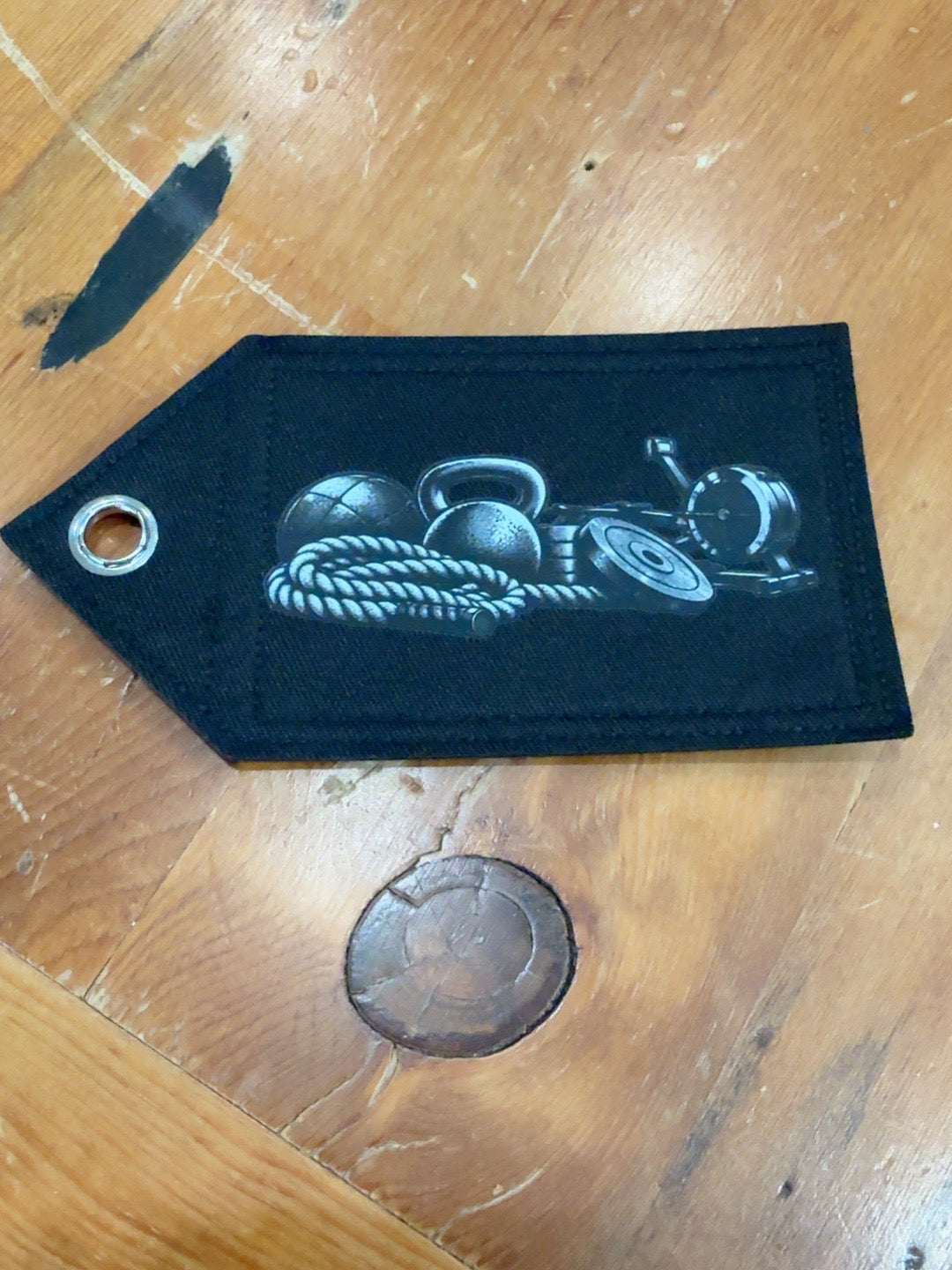 Black Patch Tag with monochrome hybrid fitness equipment design featuring battle rope, kettlebells and weights