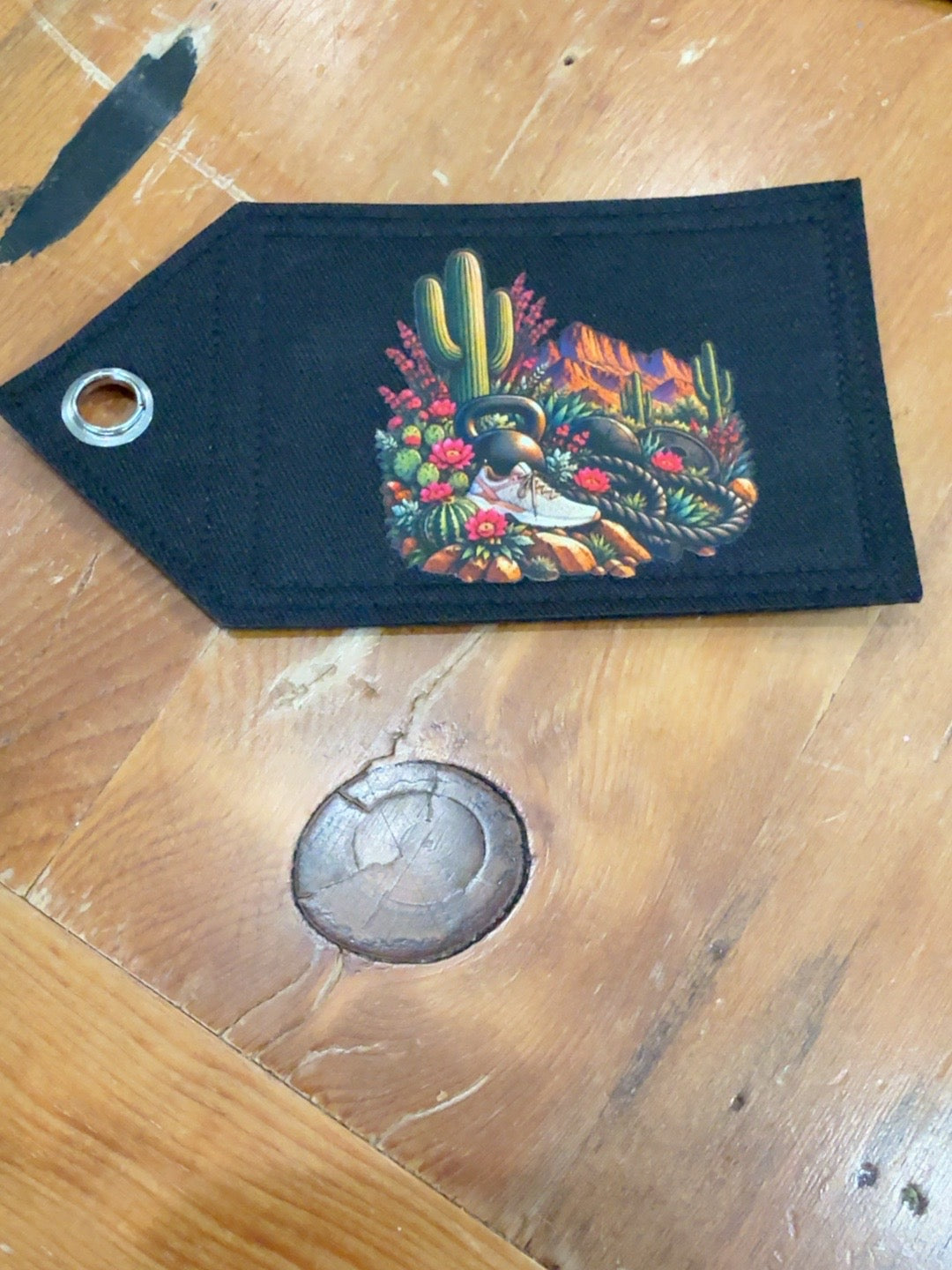 Phoenix Pink Patch Tag with saguaro cacti, bright pink desert flowers, kettlebells, rope and running shoe
